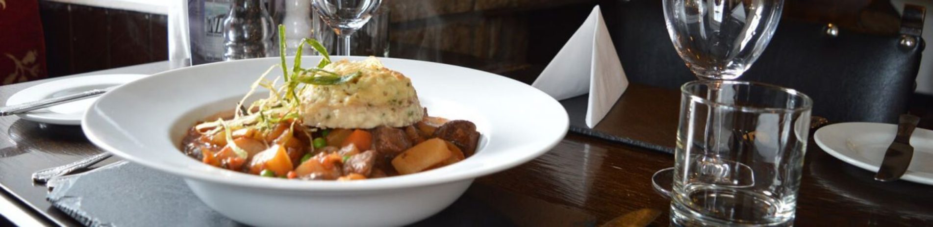 casserole-topped-with-mashed-potato-on-white-plate