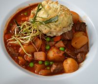 casserole-topped-with-mashed-potato-on-white-plate