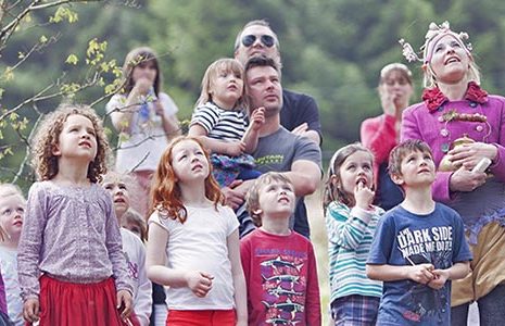 young-children-and-a-few-parents-all-looking-up-curious-mhor-festival