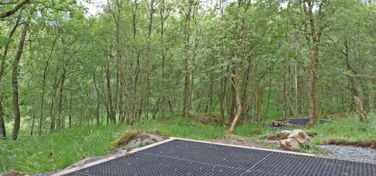 loch-chon-campsite-pitch-number-fourteen-rubber-mat-for-pitching-tent-surrounded-by-young-trees