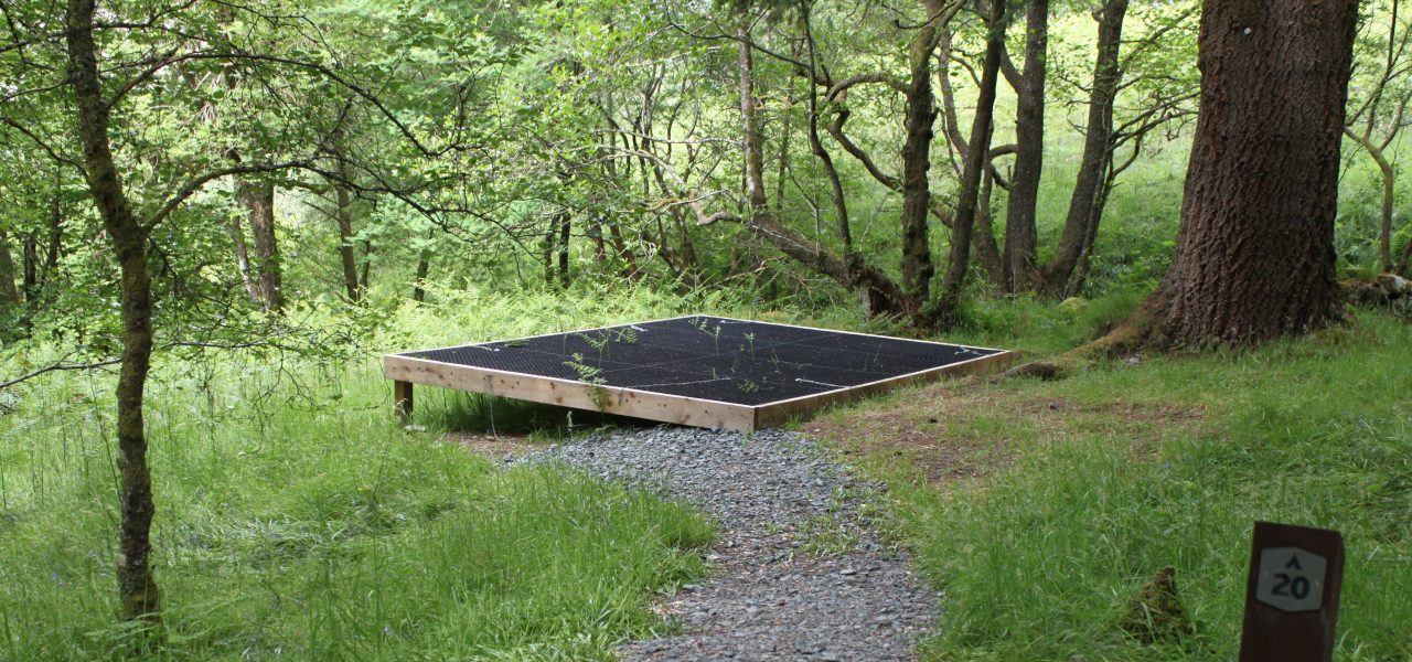 loch-chon-campsite-pitch-number-twenty-rubber-mat-for-pitching-tent-on-raised-wooden-platform-surrounded-by-trees