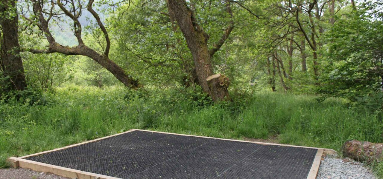 loch-chon-campsite-pitch-number-six-rubber-mat-for-pitching-tent-surrounded-by-young-trees