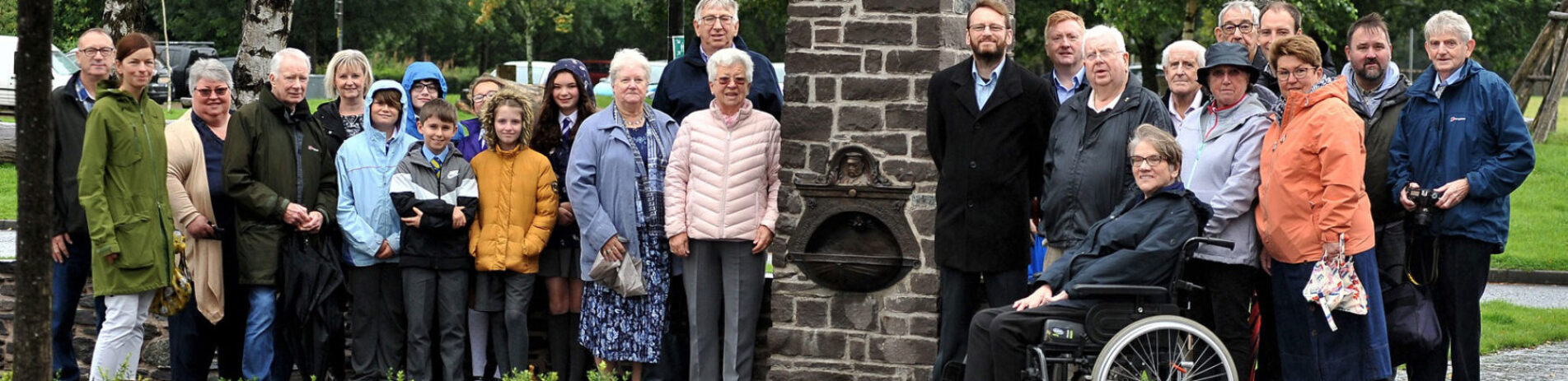 local-community-members-gathered-around-new-fountain-in-balloch-village-square-after-refurbishment