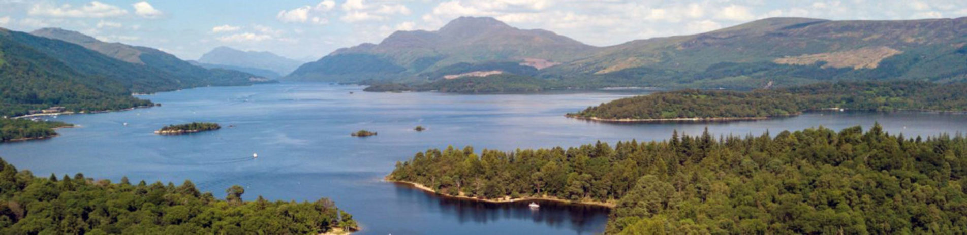 loch-lomond-aerial-photo-with-forested-islands-and-ben-lomond-visible-in-the-distance