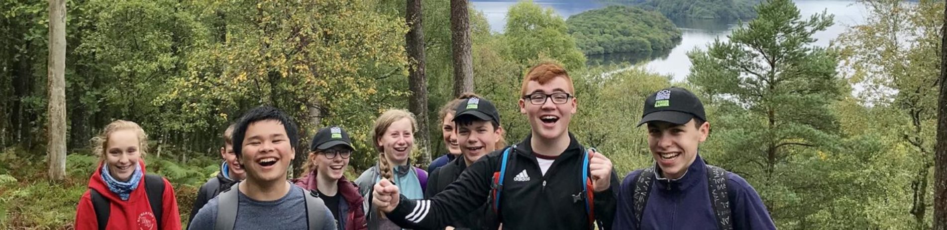group-of-junior-rangers-students-laughing-at-the-edge-of-forest-on-inchcailloch-island-on-loch-lomond