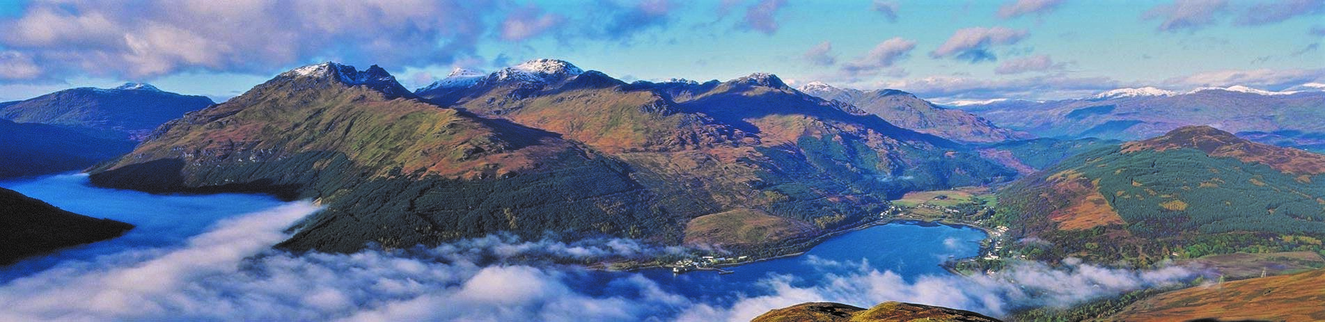 arrochar-alps-surrounded-by-cloud-inversion-and-snow-on-the-top-with-arrochar-village-visible-in-the-bottom-right-corner