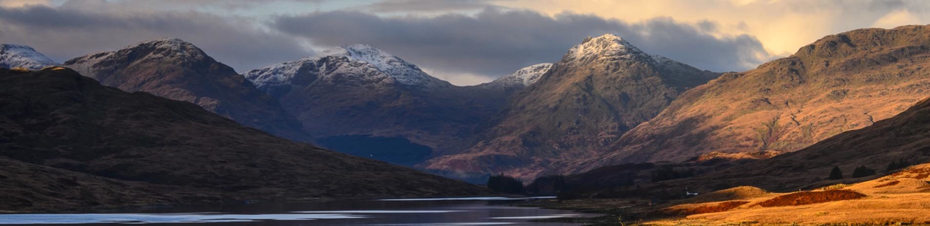 loch-arklet-at-sunset-with-arrochar-alps-covered-by-snow-in-the-distance