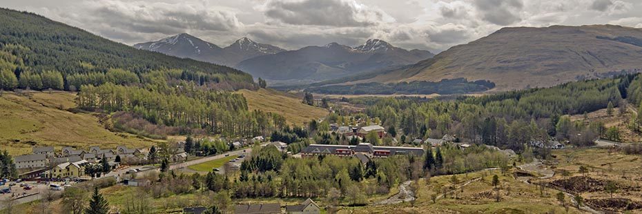 view-over-tyndrum-village-and-surrounding-forests-with-crianlarich-hills-in-the-distance