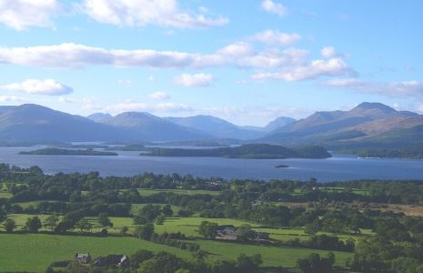 view-of-loch-lomond-islands-and-surrounding-hills-with-gartocharn-village-and-farmland-in-foreground-seen-from-dumpling-hill