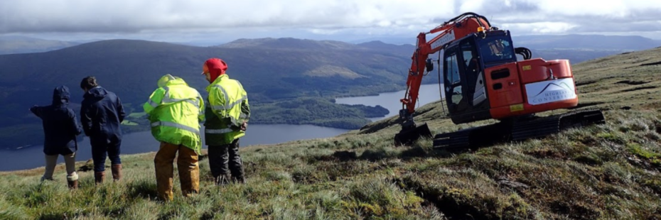 People on highland with a digger surveying the peatland landscape
