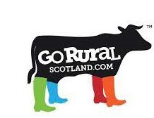Go Rural Scotland logo of black cow against white background with coloured boots on
