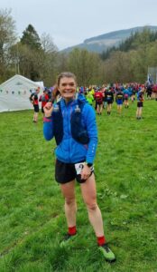 National Park member of staff in running kit about to start a running race in the National Park