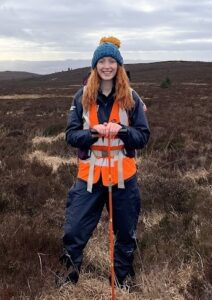 National Park staff member standing in area of peatland.